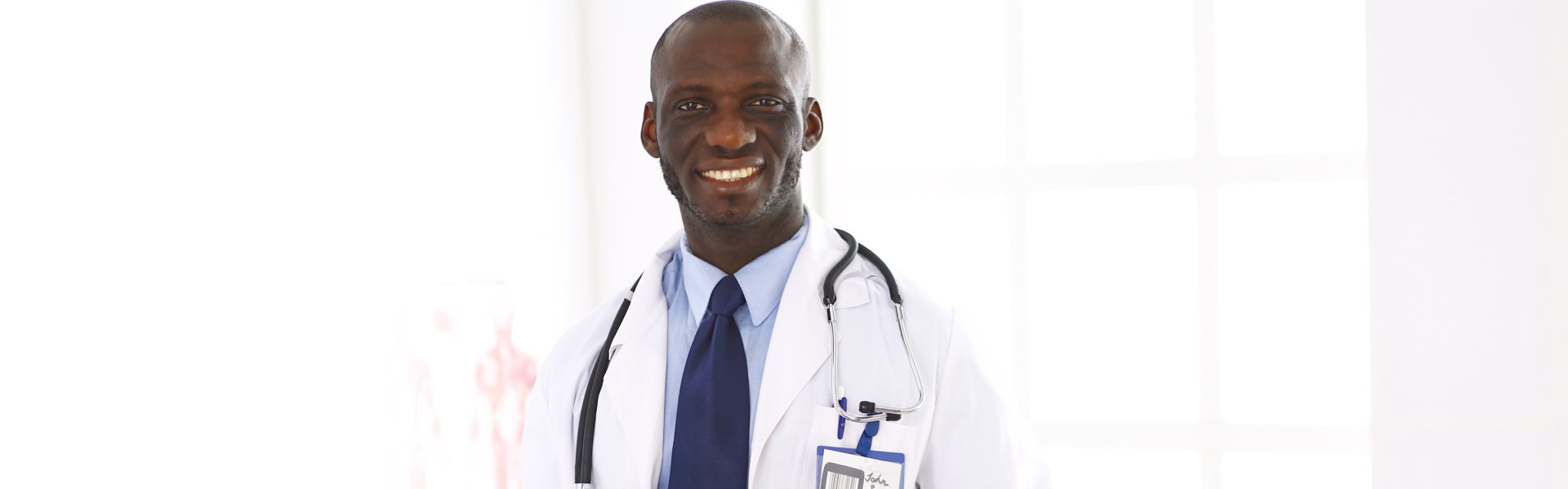 A male doctor smiling