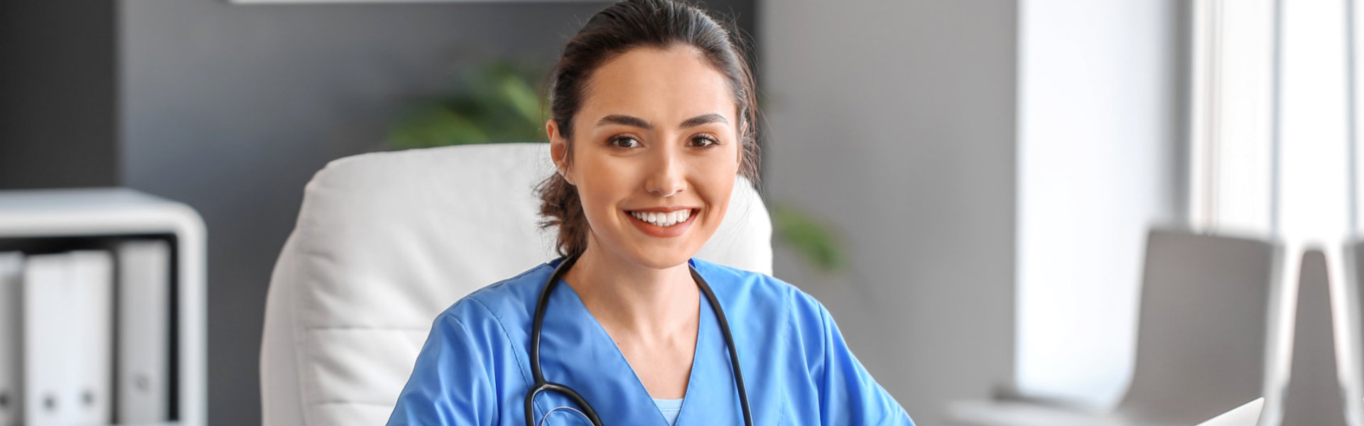 A female healthcare staff smiling