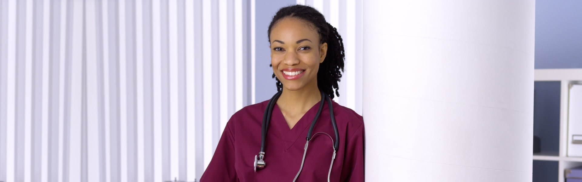 A female healthcare staff smiling